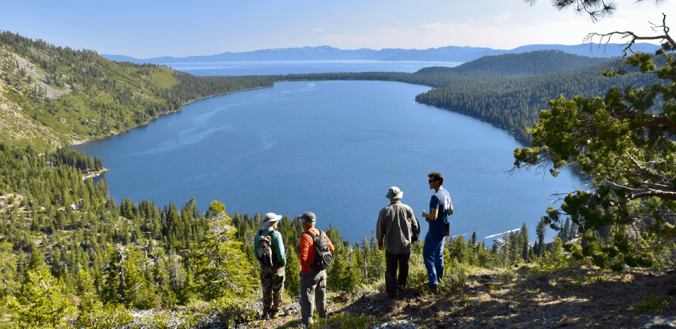 TAMBA volunteers and USFS scouting a trail.
